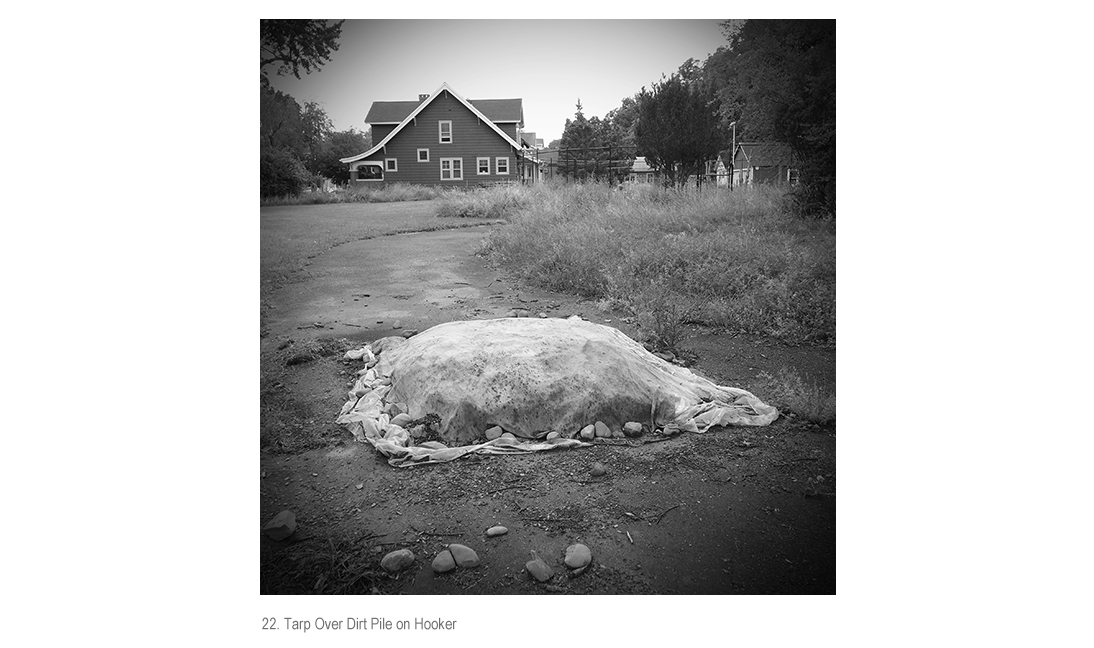 Tarp Over Dirt Pile on Hooker